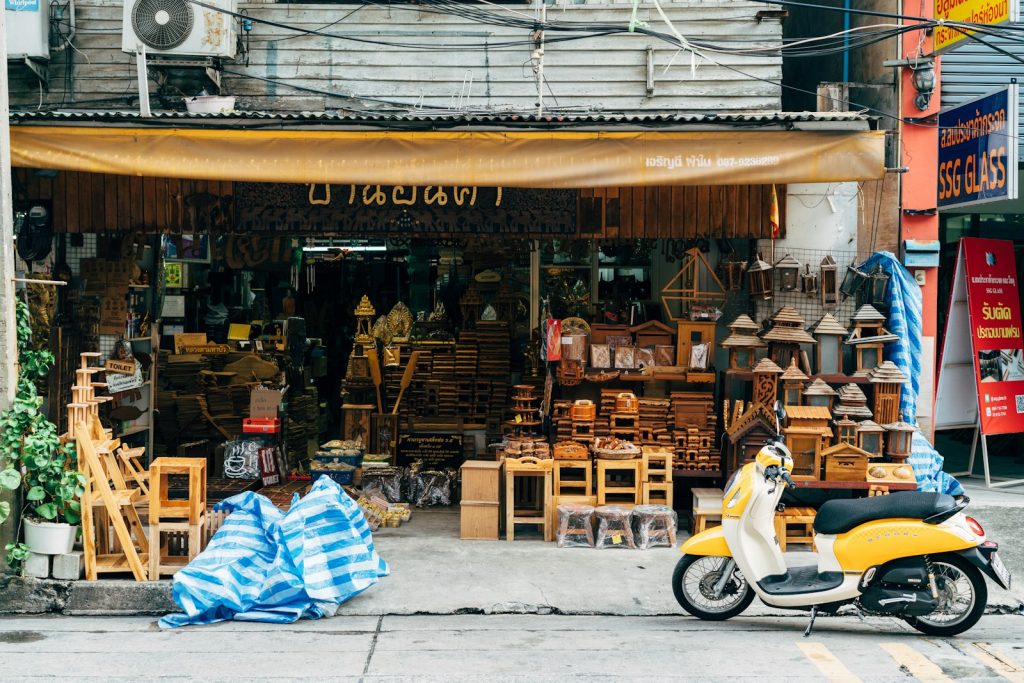 a motorcycle parked outside a shop