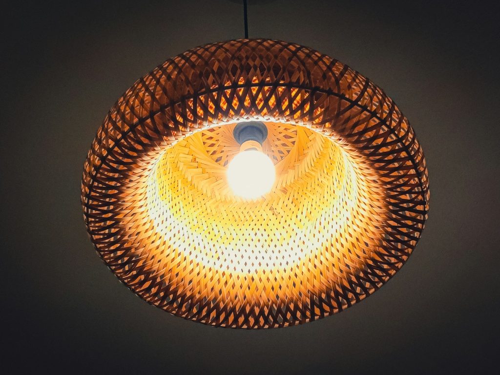 A circular light fixture hanging from a ceiling