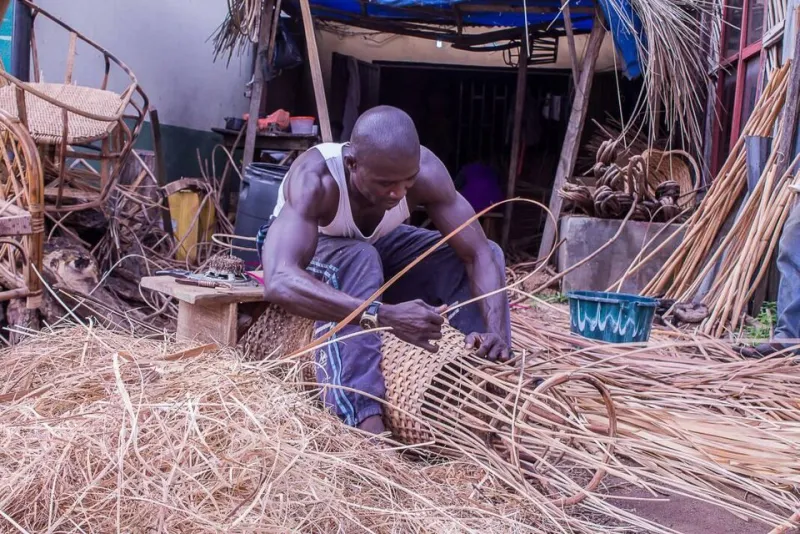 Cane furniture maker at work